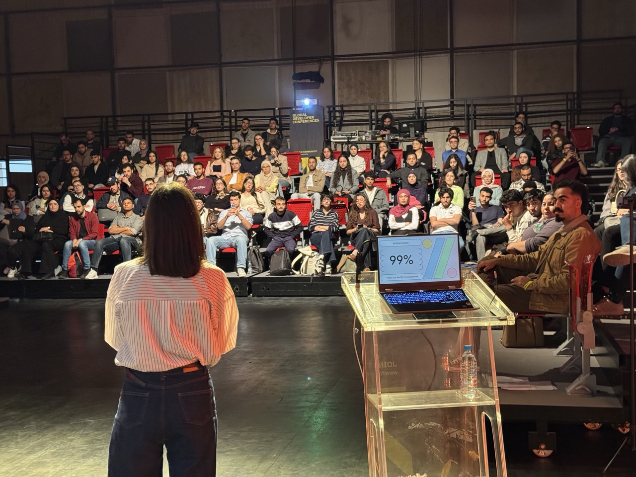 Eya Laouini presenting her talk in front of the audience